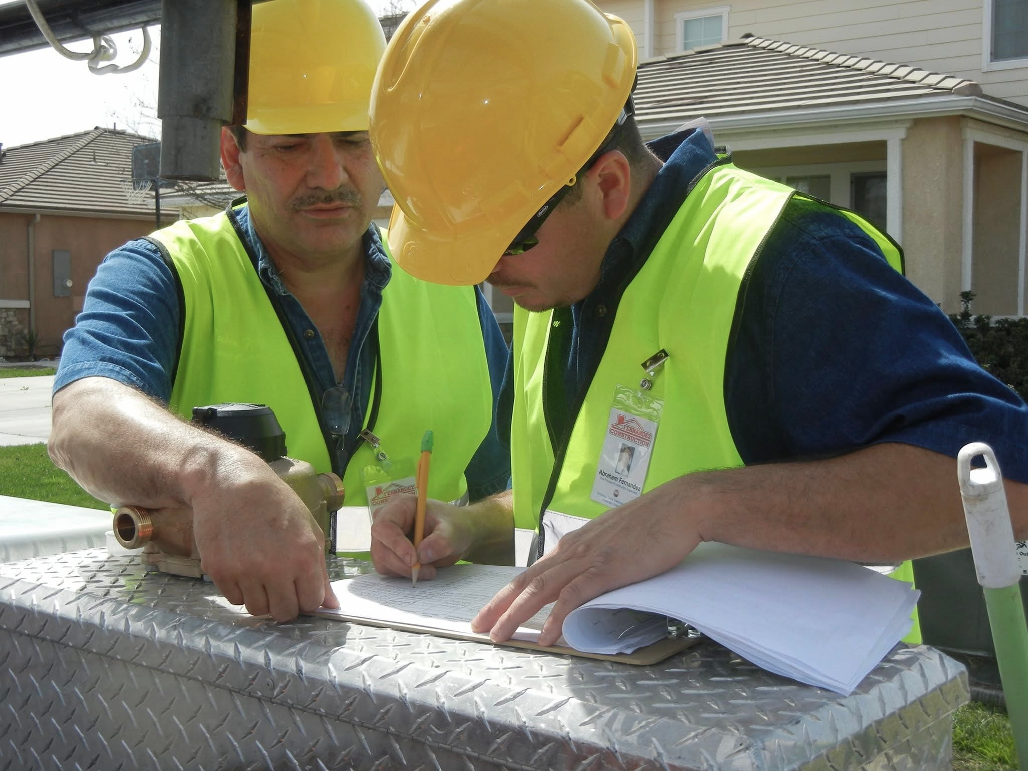 Fernandez Construction team reviewing project plans
